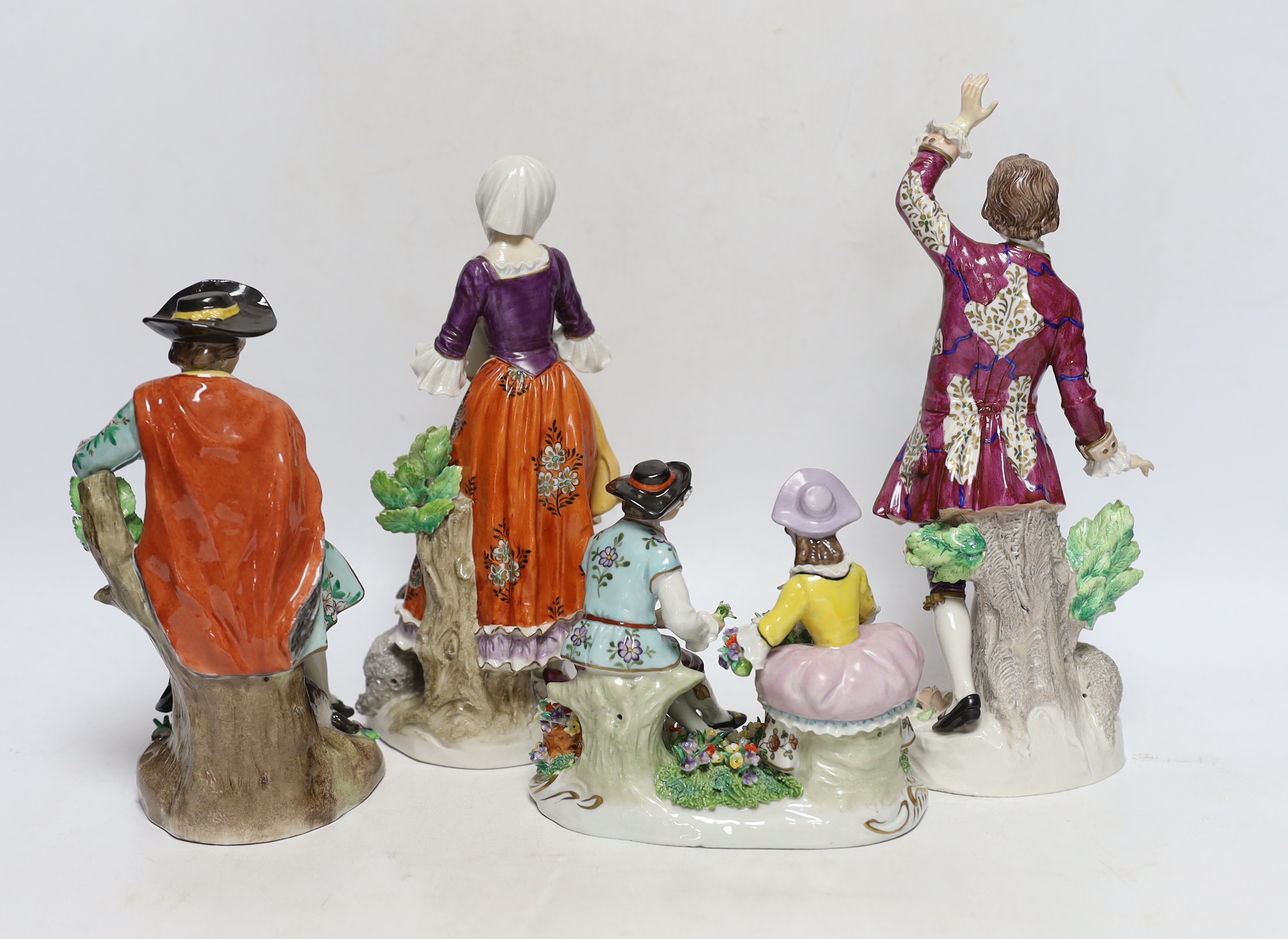Four Sitzendorf porcelain figures in groups, early 20th century, 26cm